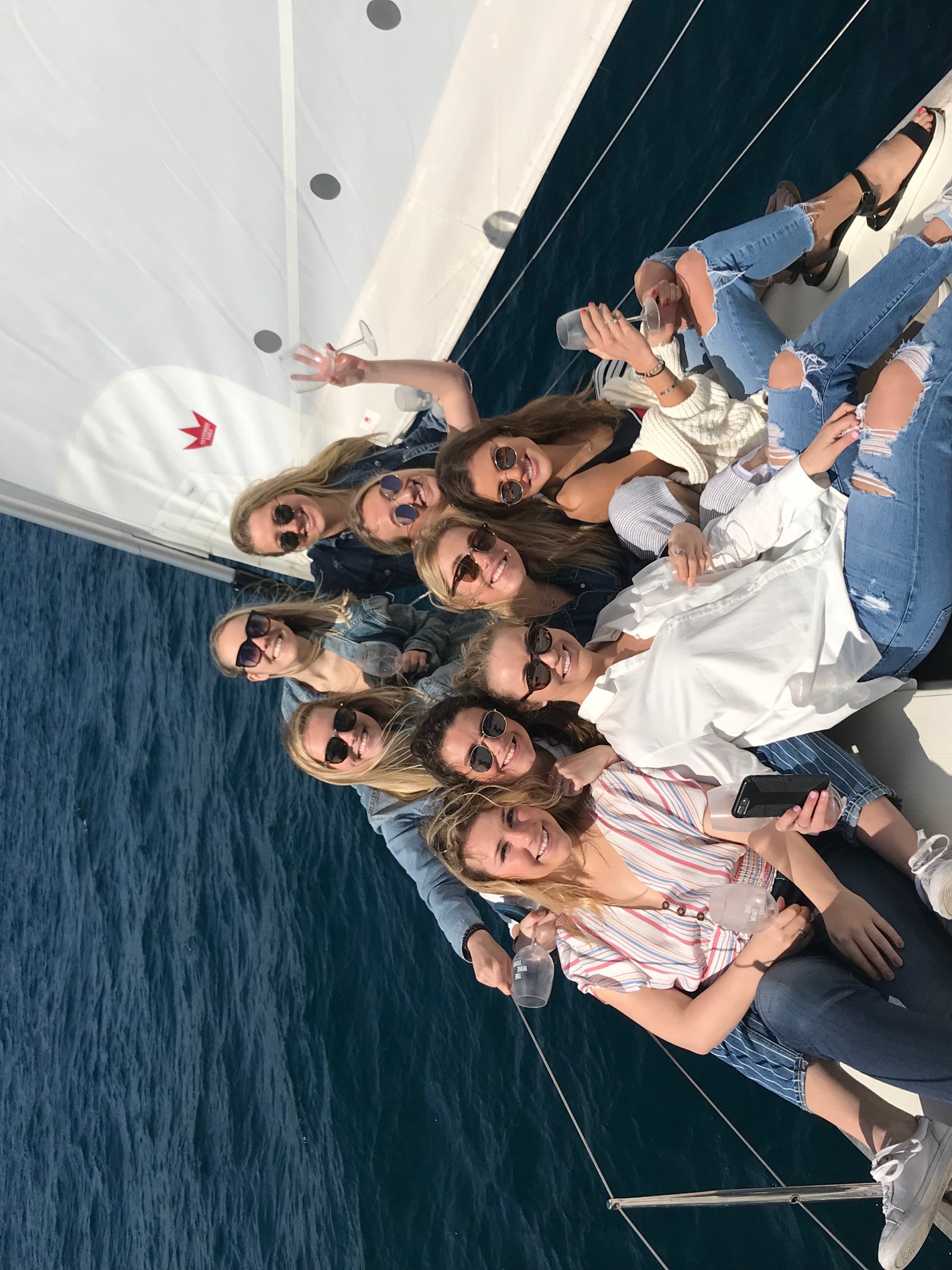 a group of people in a boat on a body of water