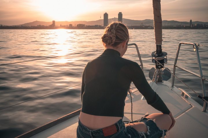 a person gzaing at the barcelona skyline by sunset
