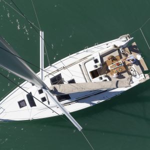 a green boat on a body of water